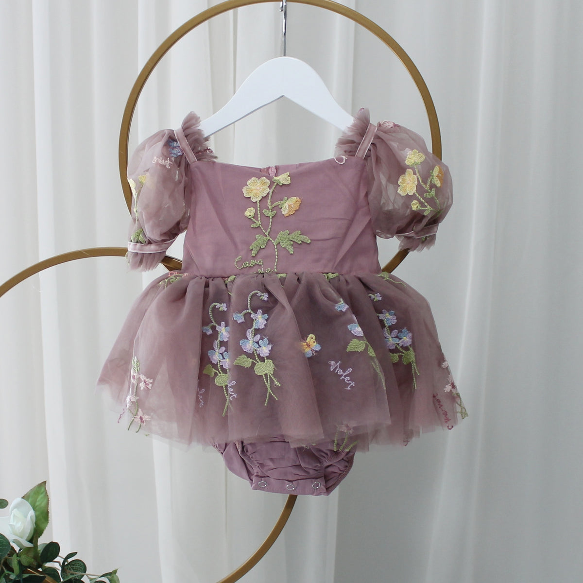 Baby Girl first birthday dress in dusty purple floral embroidery flowers for fairy and wildflower birthday parties. 