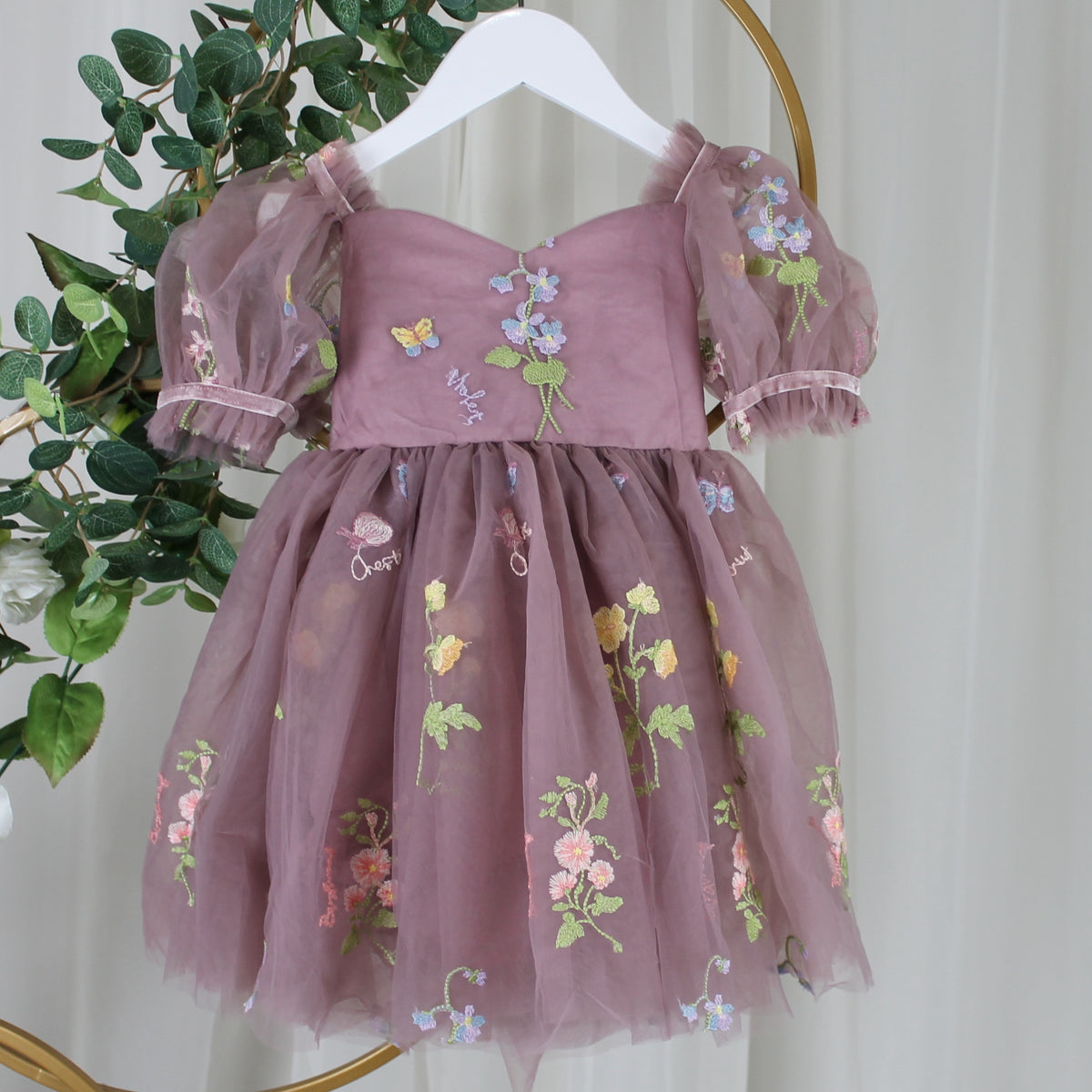 Baby Girl first birthday dress in dusty purple floral embroidery flowers for fairy and wildflower birthday parties. 