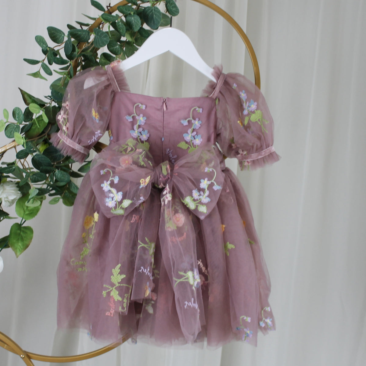 Baby Girl first birthday dress in dusty purple floral embroidery flowers for fairy and wildflower birthday parties. 