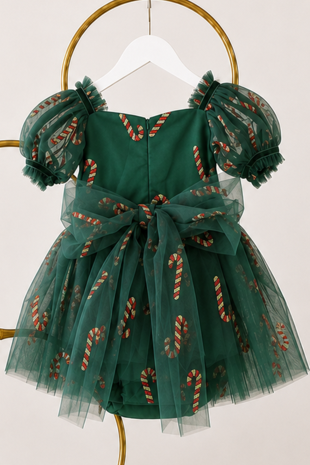 Girls green Christmas dress with sparkling red and gold candy cane accents, sweetheart neckline and full green tulle skirt.