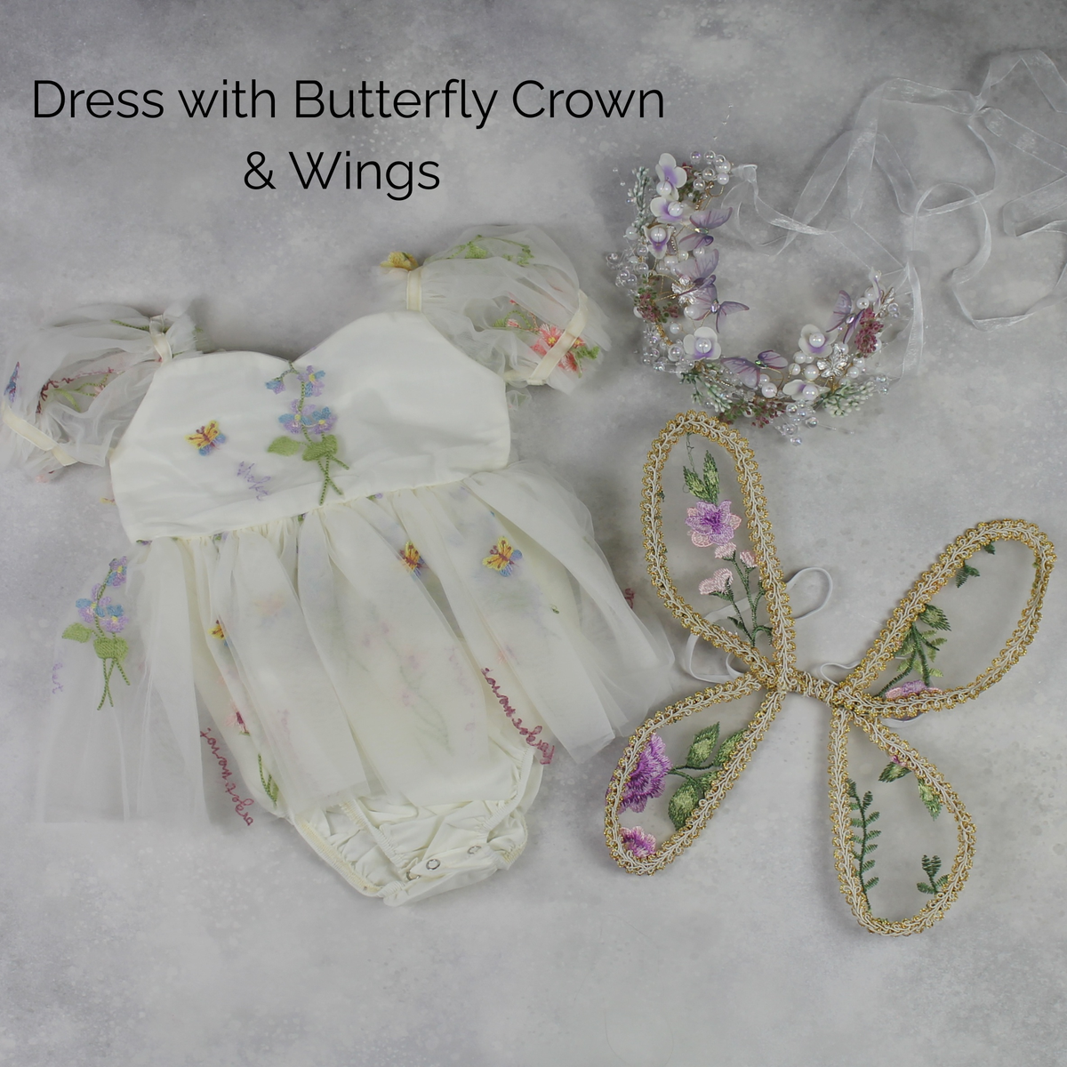 Fairy First birthday baby girls romper dress in ivory floral with wings. 