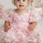 Baby girl in a light pink butterfly first birthday dress for a One Year Fluttered By party