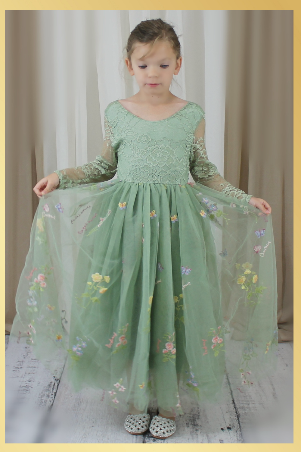 Sage green floral flower girl dress in embroidered tulle. featuring long lace sleeves and full length floral tulle dress. 