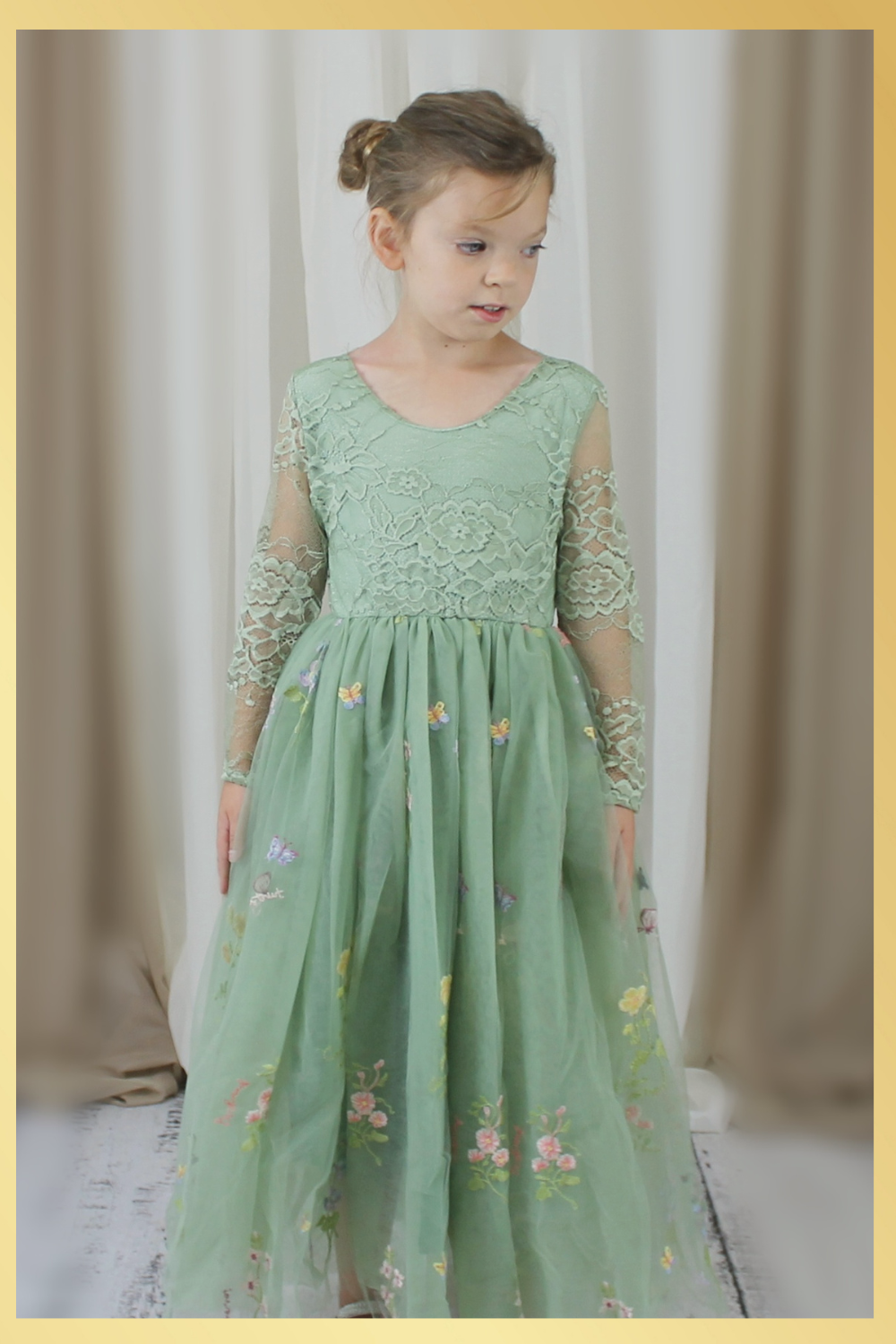 Sage green floral flower girl dress in embroidered tulle. featuring long lace sleeves and full length floral tulle dress. 