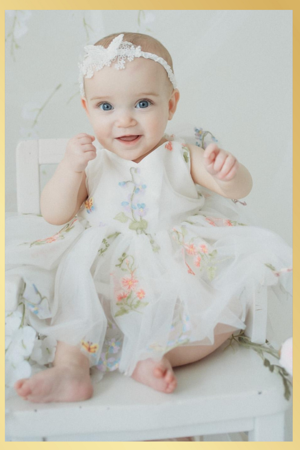 Baby girl first birthday fair dress in white florals.